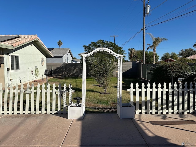 exterior space featuring a patio and a front yard