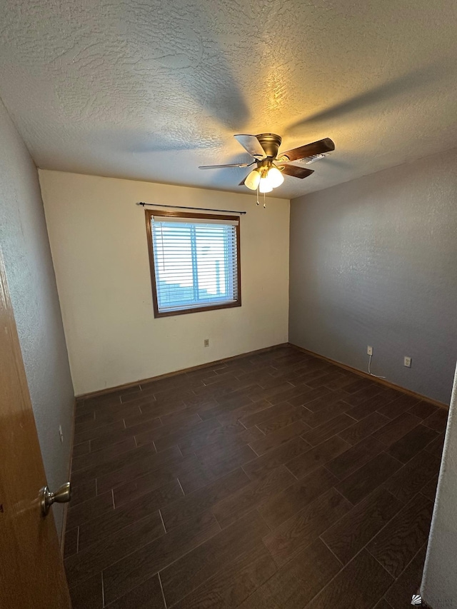 spare room featuring a textured ceiling and ceiling fan