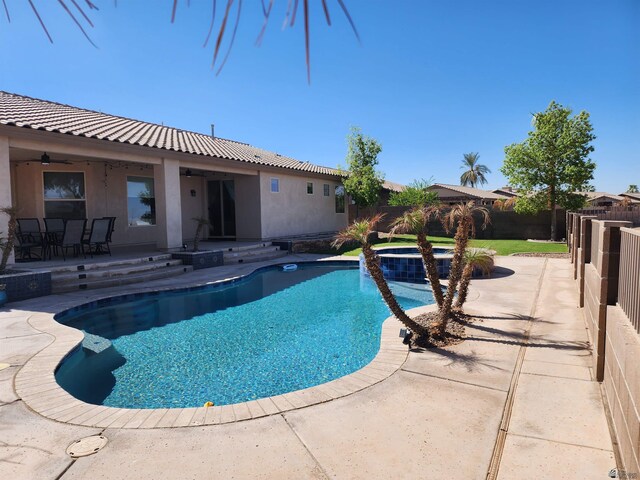 view of pool featuring a patio area and an in ground hot tub