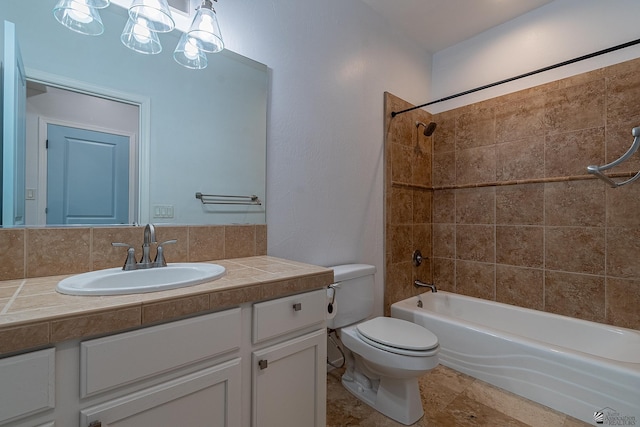 full bathroom featuring decorative backsplash, vanity, toilet, and tiled shower / bath