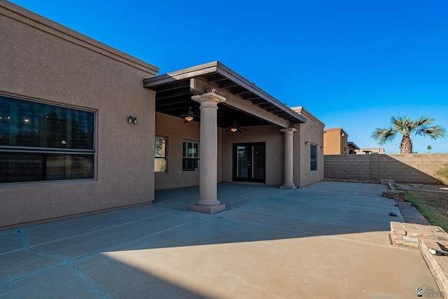 exterior space featuring ceiling fan