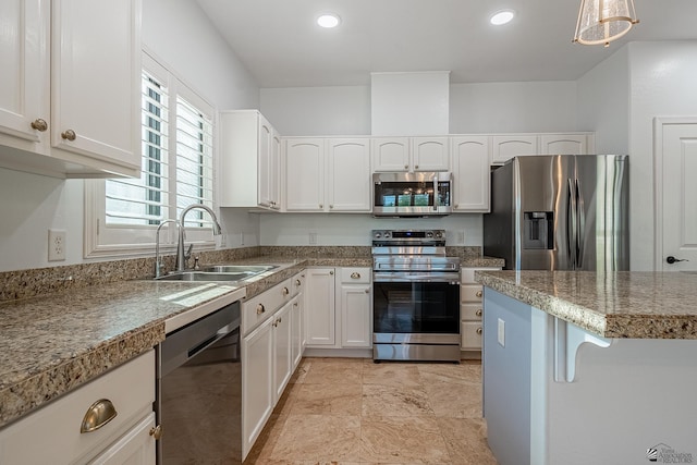 kitchen featuring white cabinetry, sink, and appliances with stainless steel finishes