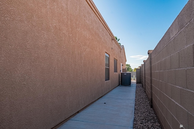 view of side of property featuring central AC unit