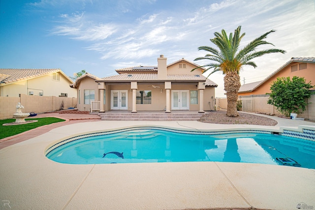 view of pool featuring a fenced in pool, french doors, a patio area, and a fenced backyard