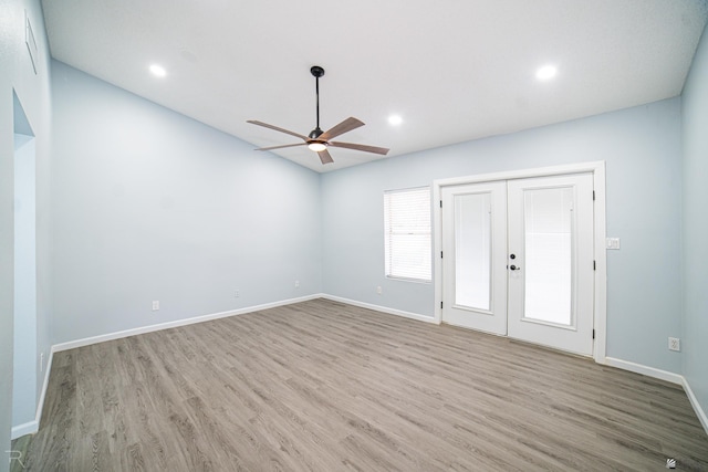 empty room with ceiling fan, recessed lighting, wood finished floors, and baseboards