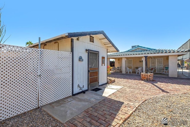 back of property with a patio