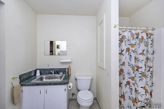 bathroom with tile patterned floors, vanity, toilet, and a shower with shower curtain