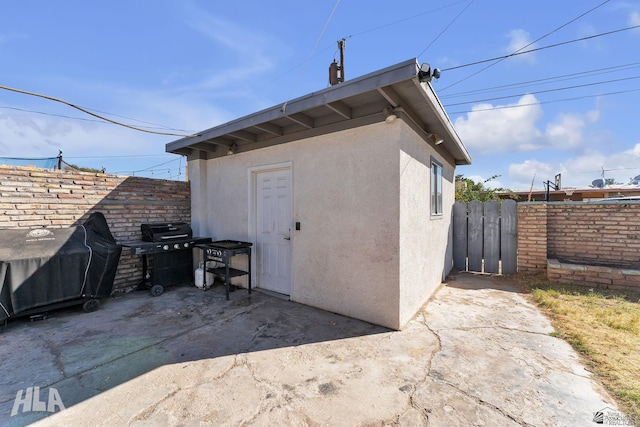 view of outbuilding with fence