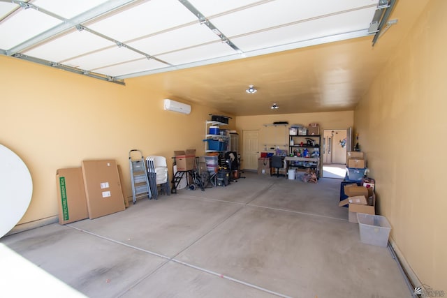 garage featuring a wall mounted AC