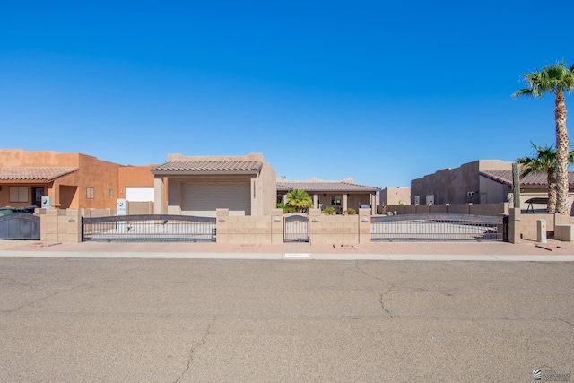 pueblo-style home with a garage