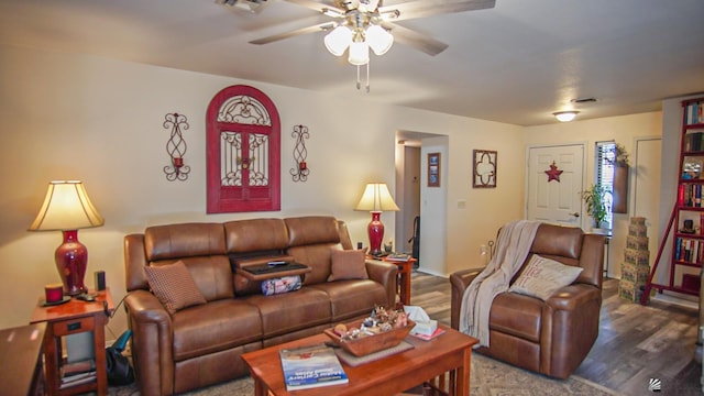 living room with ceiling fan and wood-type flooring