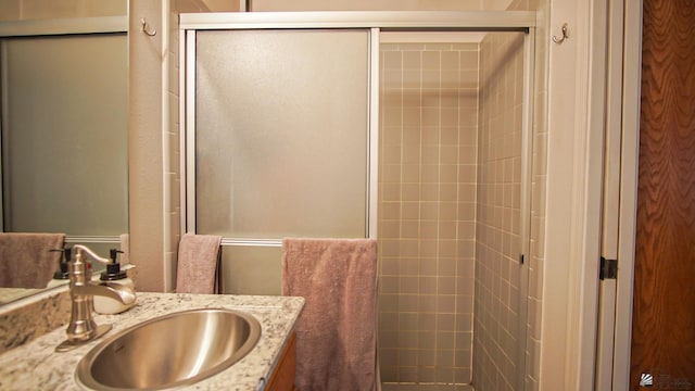 bathroom featuring vanity and walk in shower