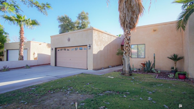 pueblo-style home featuring a front lawn