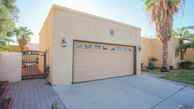 pueblo-style house featuring a garage