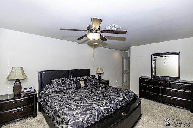 bedroom featuring light colored carpet and ceiling fan