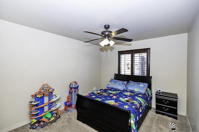 bedroom with ceiling fan and light carpet