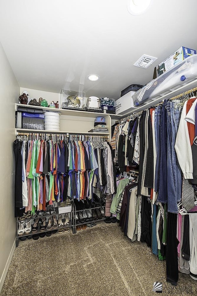 spacious closet with carpet flooring