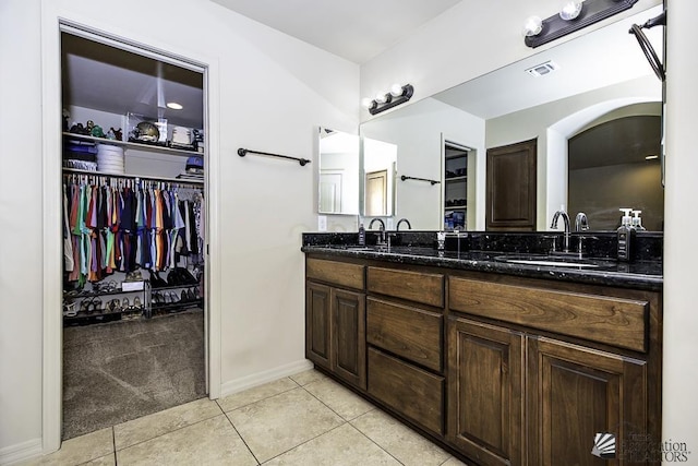 bathroom with tile patterned flooring and vanity