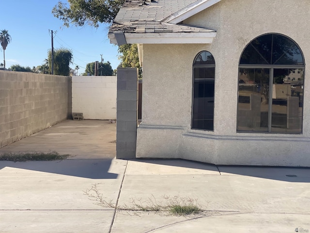 view of side of home featuring a patio area