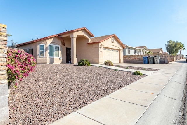 ranch-style house featuring a garage