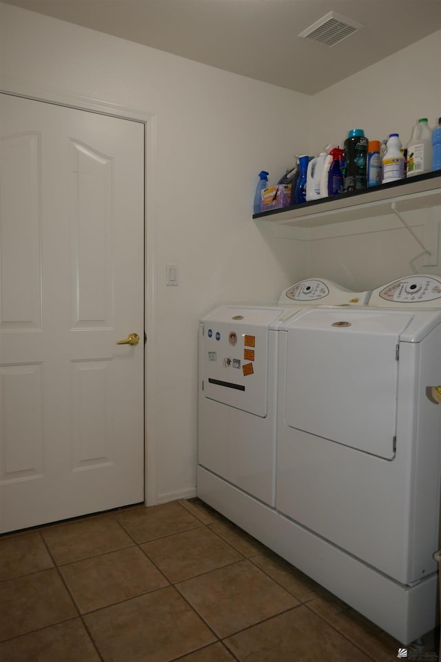 washroom with tile patterned flooring and separate washer and dryer