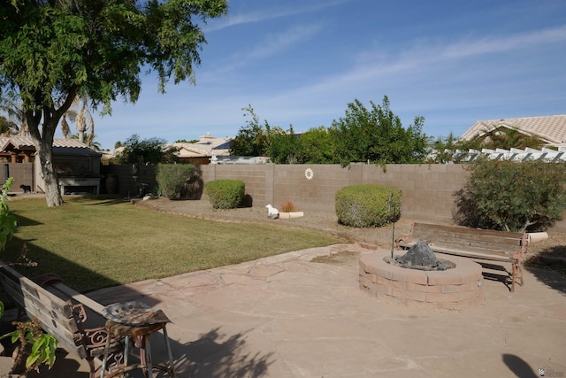 view of patio / terrace featuring an outdoor fire pit