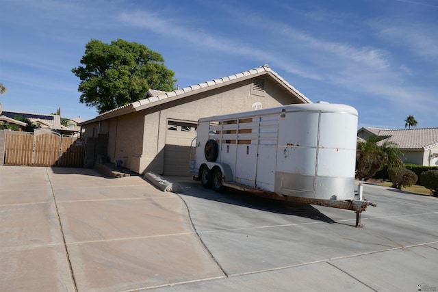 view of property exterior featuring a garage