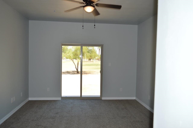 spare room with carpet and ceiling fan