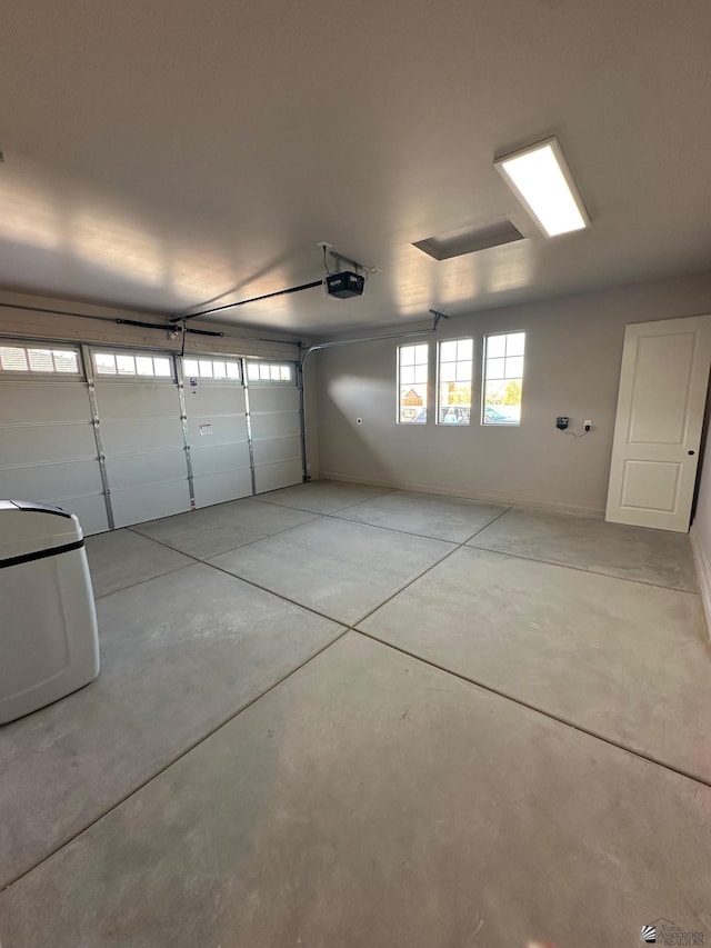 garage featuring a garage door opener