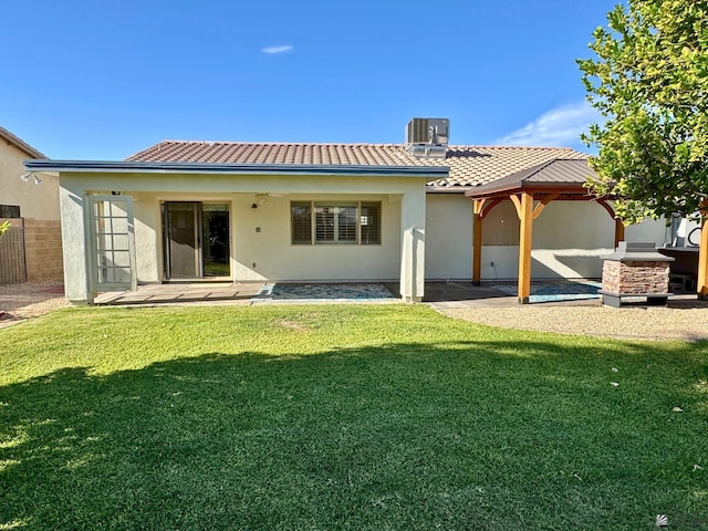 back of property with a gazebo, central AC, a lawn, and a patio