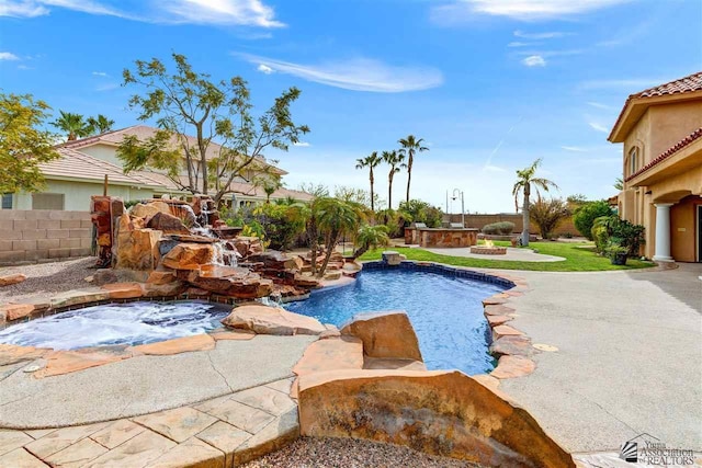 view of swimming pool with a patio and a hot tub