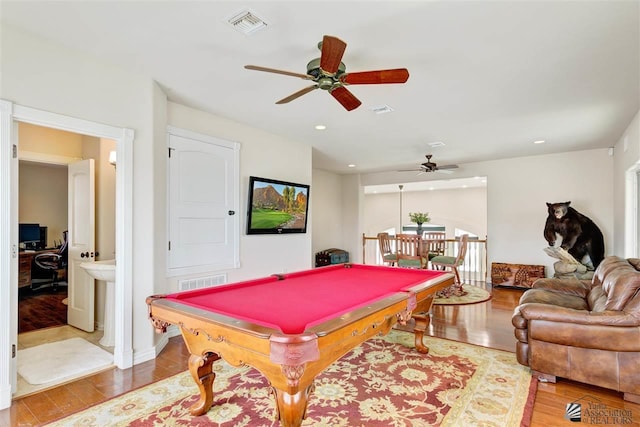 game room featuring ceiling fan, wood-type flooring, and billiards