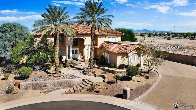 mediterranean / spanish home featuring a mountain view