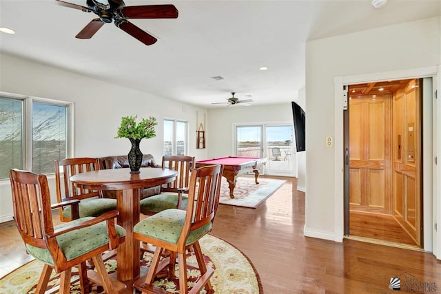 dining area featuring ceiling fan, dark wood-type flooring, and pool table