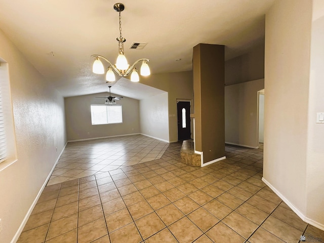 interior space featuring ceiling fan with notable chandelier, a textured ceiling, vaulted ceiling, and light tile patterned floors