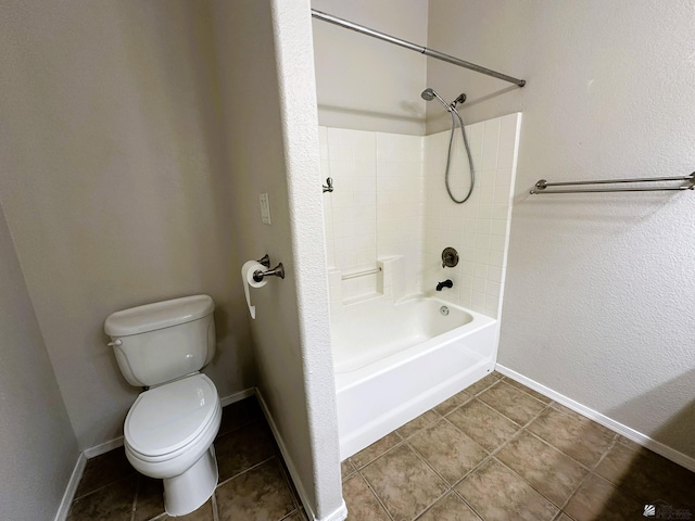 bathroom with toilet, shower / bathing tub combination, and tile patterned floors