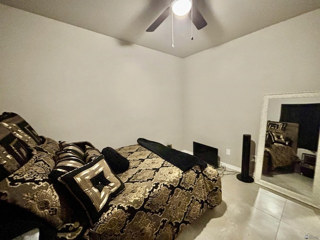 tiled bedroom featuring ceiling fan