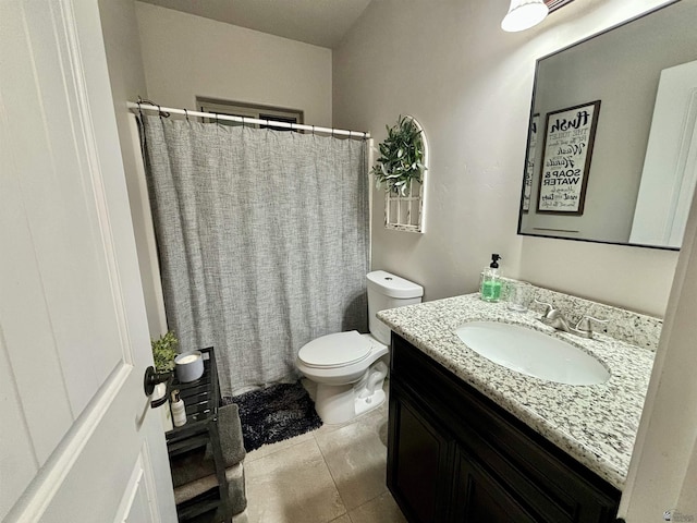 bathroom with tile patterned floors, vanity, and toilet