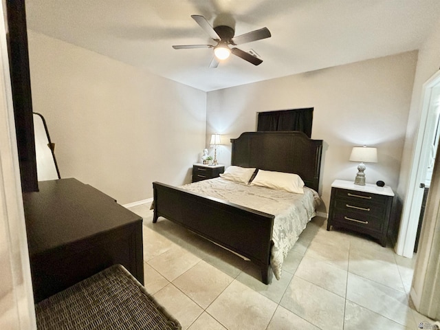 tiled bedroom with ceiling fan