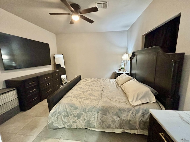 tiled bedroom with ceiling fan