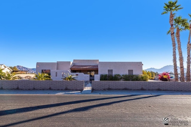 adobe home featuring a mountain view