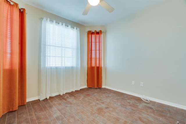 unfurnished room with hardwood / wood-style floors and ceiling fan