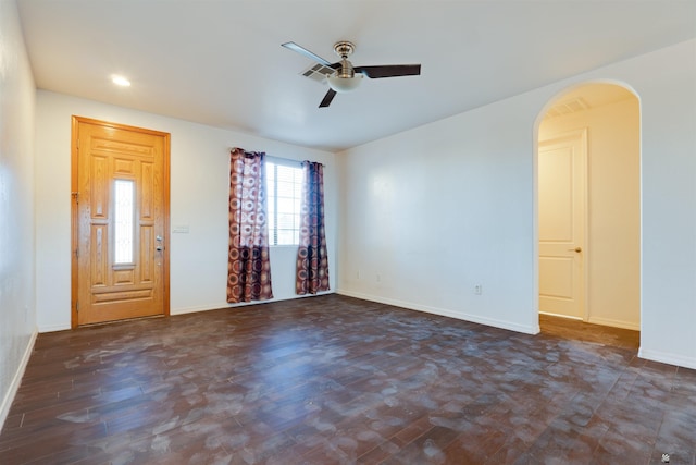 interior space featuring dark wood-type flooring and ceiling fan