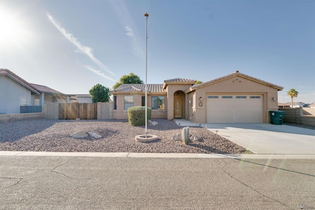 view of front of property with a garage