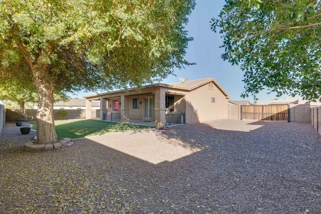 rear view of house with a patio