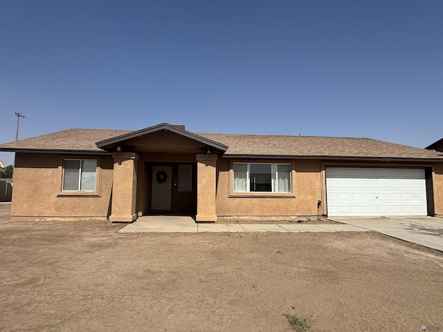 single story home featuring a garage