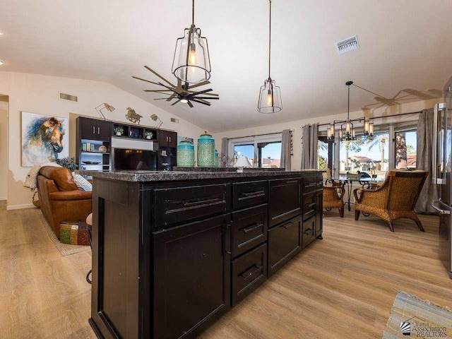 kitchen featuring pendant lighting, light hardwood / wood-style floors, and a wealth of natural light