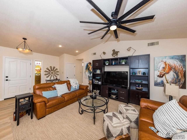 living room with light hardwood / wood-style flooring, ceiling fan, and lofted ceiling