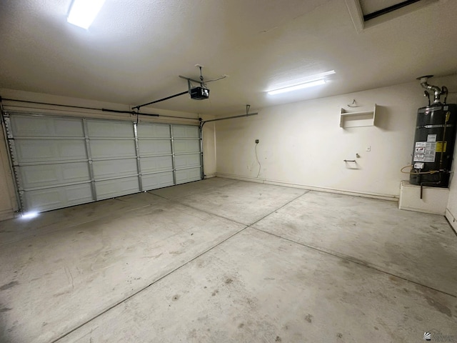 garage featuring water heater and a garage door opener