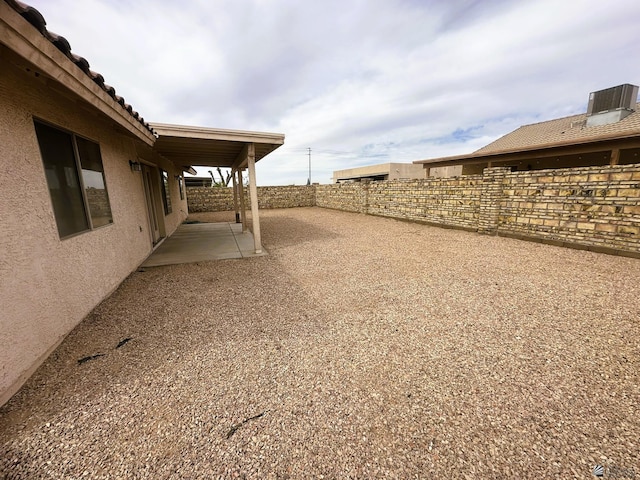 view of yard with a patio and a fenced backyard